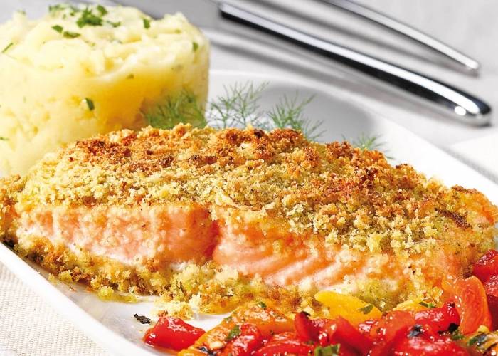 Pistachio salmon steak with roasted potatoes and peppers