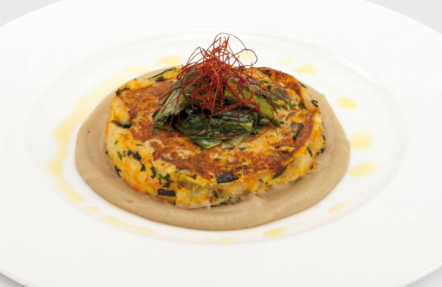 Vegetarian hambuerger on aubergines cream and chicory  