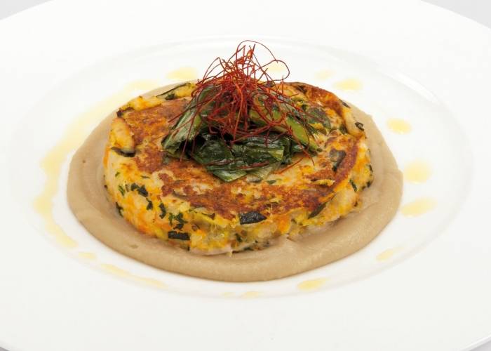 Vegetarian hambuerger on aubergines cream and chicory  